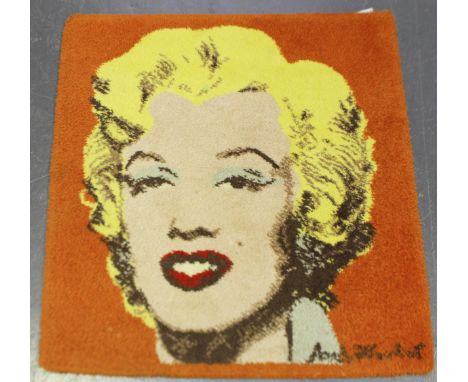 A machine made rug, depicting a portrait of Marilyn Monroe, after Andy Warhol, 85cm x 80cm.Buyer’s Premium 29.4% (including V