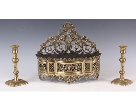 A 19th century Dutch brass wall sconce of serpentine outline with foliate cast backplate, width 31cm, together with a pair of