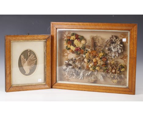 A fine Victorian cut card panel depicting a hanging bird, mounted within a bird's eye maple frame, 32cm x 27cm, together with