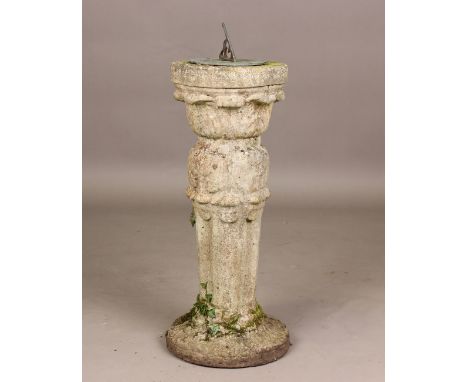 A 20th century cast composition stone garden sundial, raised on an acanthus leaf moulded stand, height 71cm.Buyer’s Premium 2