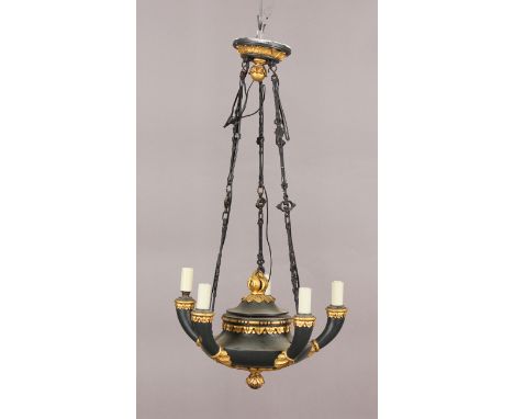 An early 20th century Regency style black painted and gilt decorated hanging ceiling light of classical oil lamp form, height