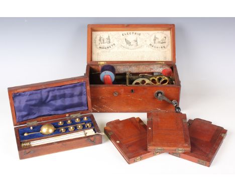 A late Victorian mahogany cased 'Magneto Machine', a Sikes hydrometer and three mahogany plate camera slide holders.Buyer’s P