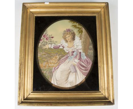 An early 20th century silkwork oval panel, finely worked with a lady seated in a garden, accompanied by a dog, 22cm x 18cm, w