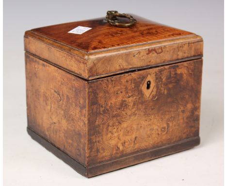A George III fruitwood tea caddy with hinged lid enclosing a single lidded interior, height 15cm, width 14cm.Buyer’s Premium 