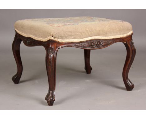 A late 19th century rosewood stool, the needlework seat raised on carved cabriole legs, height 41cm, width 59cm, depth 55cm.B