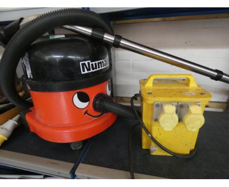 A 110V Henry Hoover with tools and a 110/240V transformer 