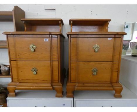 A pair of pine two drawer bedside chests, each with shelf back 
