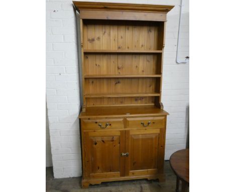 A pine kitchen dresser with shelf back, drawers and cupboards under, 3' wide 