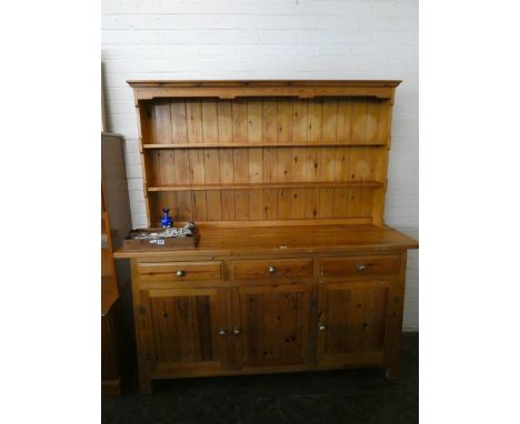A pine kitchen dresser with shelf back, three drawers and cupboards under, 5'3 wide 