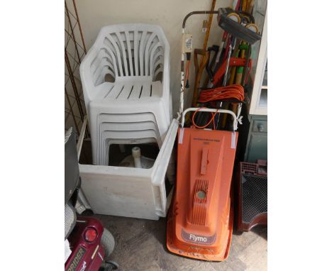 A quantity of garden tools, brooms, brushes, a Sprint Master Flymo lawn mower, plastic garden seats etc 