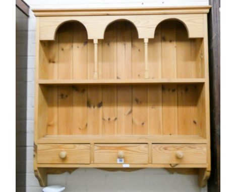 A wax pine kitchen wall shelf fitted three drawers 