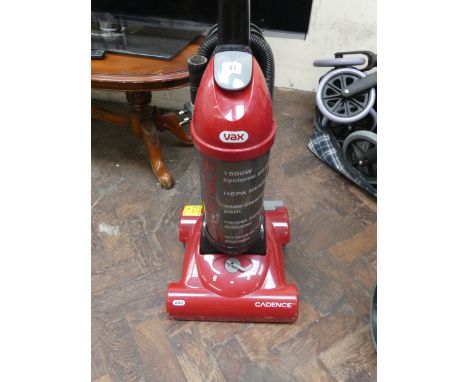 A red Vax upright carpet cleaner 