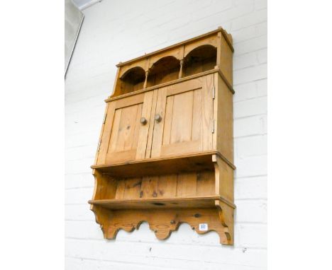 A pine wall hanging cupboard with shelf under 