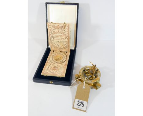  A collectable replica of an antique compass and another similar brass model 
