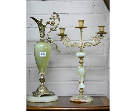 An onyx and gilt metal mounted ewer and a similar three branch candlestick 