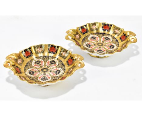 ROYAL CROWN DERBY; a pair of twin handled comports decorated in the 1128 pattern, width 16cm.Additional InformationLight wear