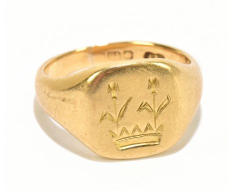 An 18ct gold signet ring, size M, weight 9.4g.
