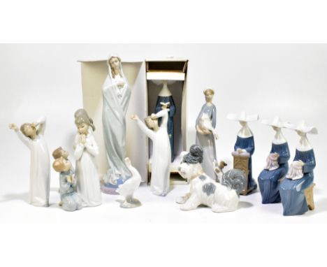 LLADRO; a collection of ten ceramic figures, including The Virgin Mary, height 36cm, Prayerful Moment, etc, and two ceramic m