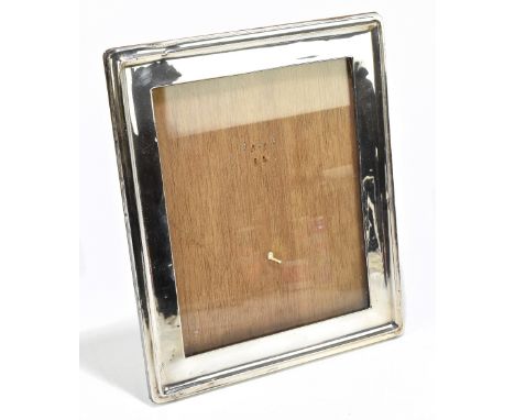 A George V hallmarked silver mounted oak rectangular photograph frame, Birmingham 1918, height 28cm, width 33cm (1)Additional