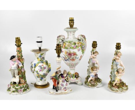 Five 19th century and later German porcelain lamps, comprising twin handled floral encrusted lamp, decorated with figures in 