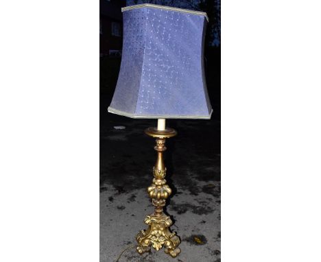 A large ornate gilt lamp, height 73cm.