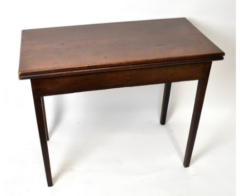 A George III oak fold over tea table, with rectangular top, on tapered legs, height 74cm, width 91cm, depth 45cm.&nbsp;Additi