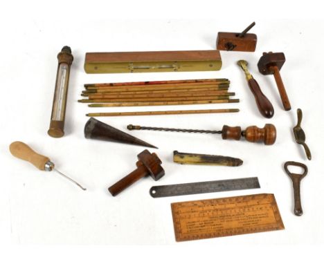 A collection of various miniature woodworking tools to include a woodworking plane, a spirit level and a leather working tool