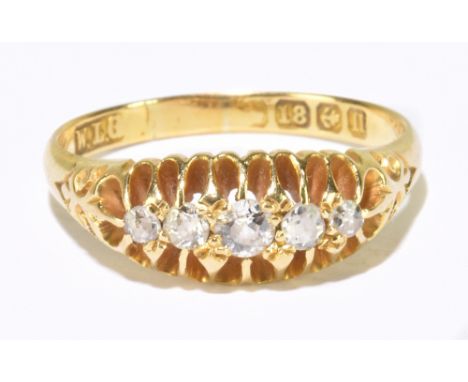 An 18ct yellow gold and diamond five stone graduated ring, size L 1/2, approx 3g.Additional InformationThe largest diamond is