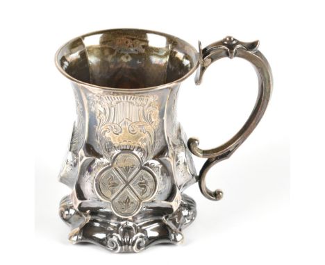 GEORGE UNITE; a Victorian hallmarked silver christening mug with chased scrolling decoration and three quadriform cartouches,