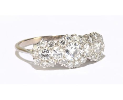 An 18ct white gold diamond cluster ring, formed of five central brilliant cut diamonds, with twenty-two smaller brilliant cut