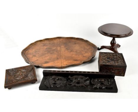 A small group of treen to include a carved wooden box, a walnut tray and an apprentice piece of a tilt-top tripod table.