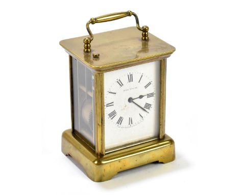 THE NEW HAVEN CLOCK COMPANY USA; an eight day brass cased carriage clock, the enamel dial set with Roman numerals, height inc