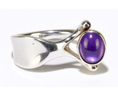 GEORG JENSEN; a silver and cabochon amethyst ring, no.152 designed by Vivianna Torun Bulow Hube, size P, approx 8.08g.Additio