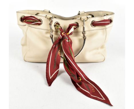 GUCCI; a cream leather 'Positano' handbag with gold tone hardware, top D-shaped handles and a Gucci silk monogrammed burgundy