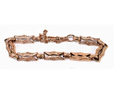 A 9ct rose gold fancy link engraved bracelet, approx. 19g.Additional InformationPresented with a safety chain, some of the se