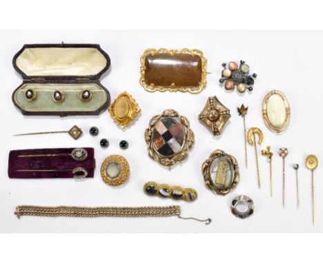 A collection of Victorian and later pinchbeck gilt metal mounted brooches, including a Scottish example set with a selection 