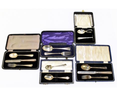 Five hallmarked silver christening cutlery sets, various dates and makers, with a lace back hunting spoon, and a further silv