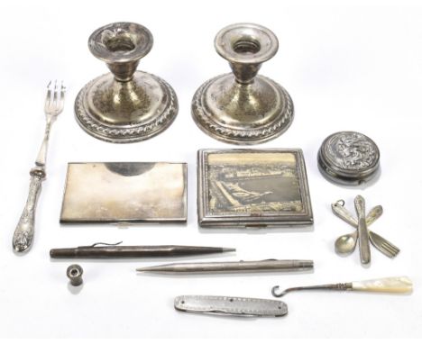 A pair of sterling silver squat candlesticks with cast rope twist rim, with impressed marks (weighted), and a selection of si