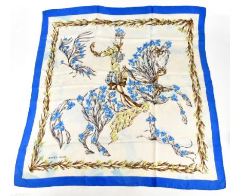 HERMES; a vintage 1960s 100% silk scarf by Henri D'Origny depicting blue irises and flowers within a contrasting blue border,