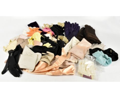 Thirty pairs of vintage gloves, including large sheepskin gloves, early 20th century soft kid leather gloves, lurex gold glov