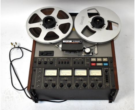 TEAC, an A-3400 four channel Simul Sync reel to reel recorder, with faux rosewood sides.&nbsp;
