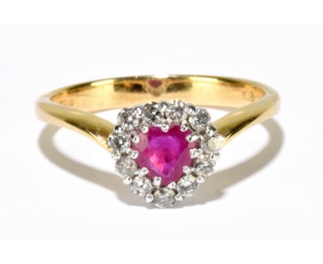 An 18ct yellow gold heart shaped ruby and diamond cluster ring, size L 1/2, approx. 2.8g.Additional InformationThe ring head 