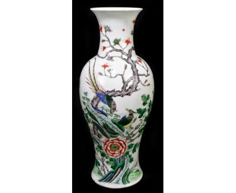 A late 19th century Chinese Famille Verte porcelain vase decorated in enamels with birds in landscape setting, height 45cm (a