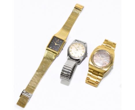 OMEGA; a gentleman's gilt steel Megaquartz wristwatch, with day and date apertures and baron numerals, with a gentleman's sta