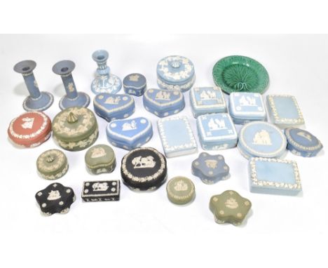 WEDGWOOD; a large assortment of jasperware boxes and covers, various designs and shapes, with a pair of candlesticks, height 