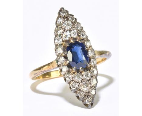 An 18ct yellow gold synthetic sapphire and diamond lozenge shaped ring, the central dark blue sapphire within a framework of 