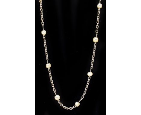A white metal trace chain set with seed pearls, length 46cm, approx. 3g.Additional InformationUnmarked, light general surface