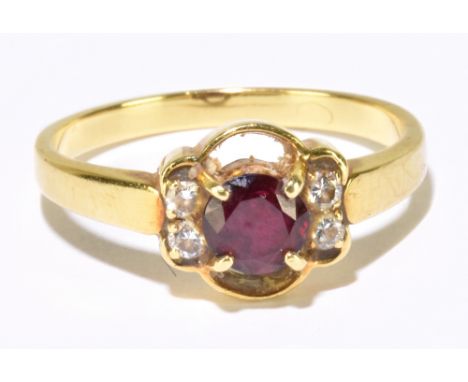 An 18ct yellow gold ruby and diamond ring with pierced flowerhead setting, size O, approx 3.44g.Additional InformationPresent