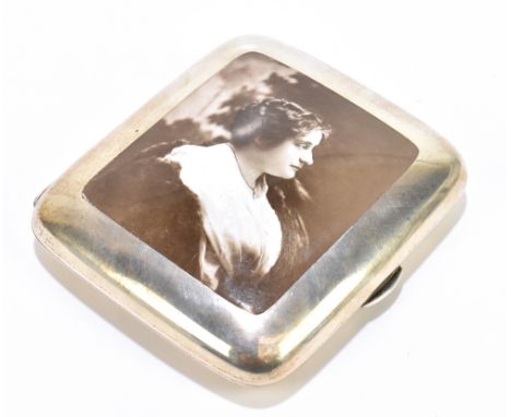 COLEN HEWER CHESHIRE; an Edward VII hallmarked silver and enamel cigarette case, the front decorated with a black and white p