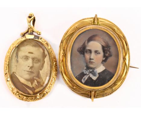 A Victorian mourning brooch with filigree frame and central photographic portrait with hair compartment to the reverse, 5cm, 